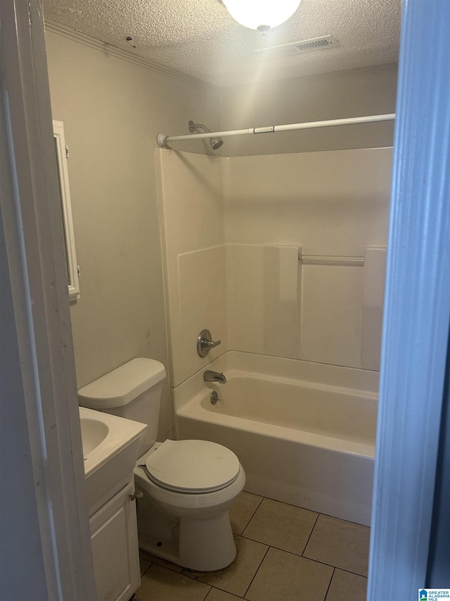 full bath featuring toilet, tile patterned flooring, a textured ceiling, and vanity