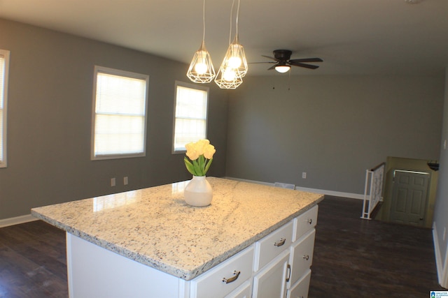 417 Argonne Dr NE, Center Point, AL 35215 - kitchen with hanging light fixtures, light stone counters, a kitchen island, and white cabinets