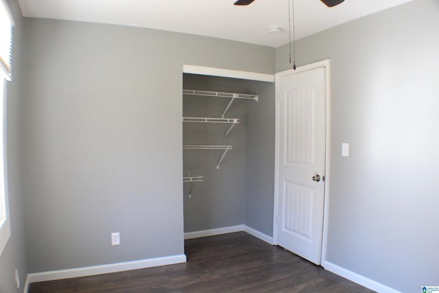 417 Argonne Dr NE, Center Point, AL 35215 - unfurnished bedroom with dark wood-type flooring, a closet, ceiling fan, and baseboards