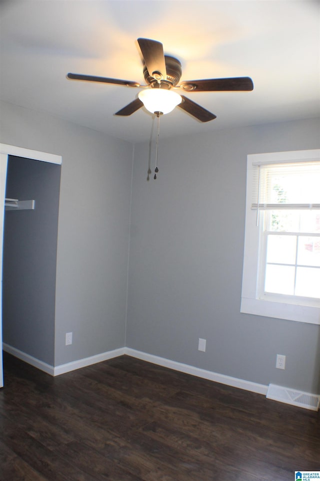 417 Argonne Dr NE, Center Point, AL 35215 - empty room featuring a ceiling fan, dark wood-style flooring, visible vents, and baseboards
