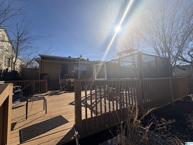 rear view of property with a wooden deck