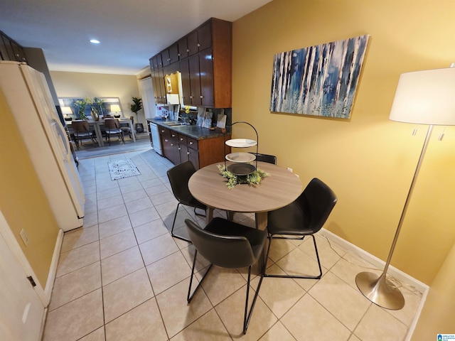 dining area with recessed lighting, baseboards, and light tile patterned floors