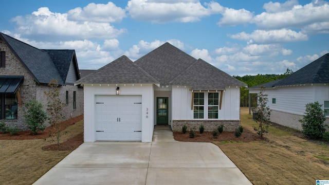 view of front of house with a garage, driveway, roof with shingles, board and batten siding, and brick siding