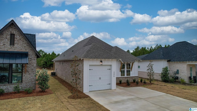 view of front facade featuring roof with shingles, an attached garage, a front lawn, board and batten siding, and brick siding