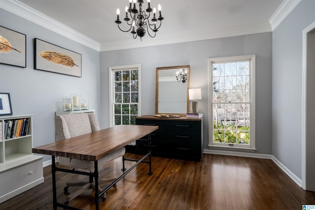 office space featuring dark wood-style floors, a notable chandelier, ornamental molding, and baseboards