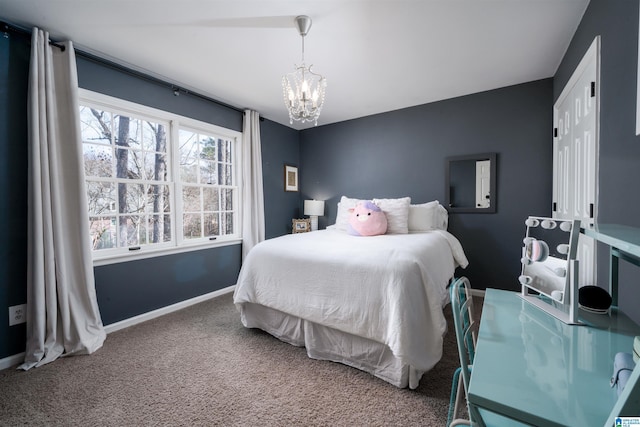 bedroom featuring carpet floors, a chandelier, and baseboards