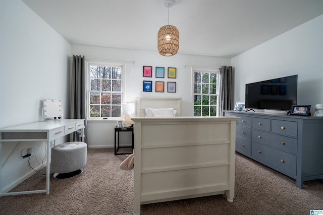 bedroom with carpet floors and baseboards