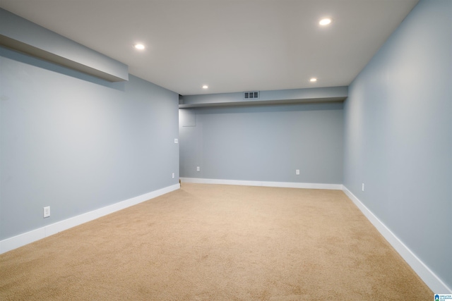 finished below grade area featuring baseboards, carpet, and recessed lighting