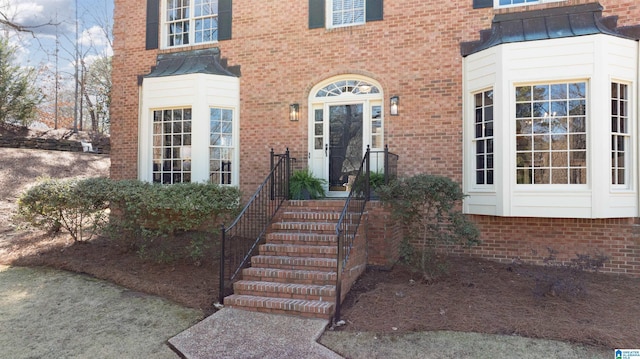 property entrance with brick siding