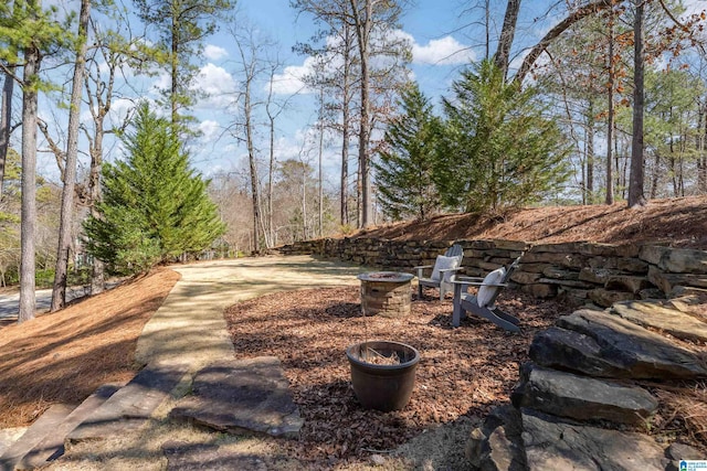 exterior space featuring an outdoor fire pit