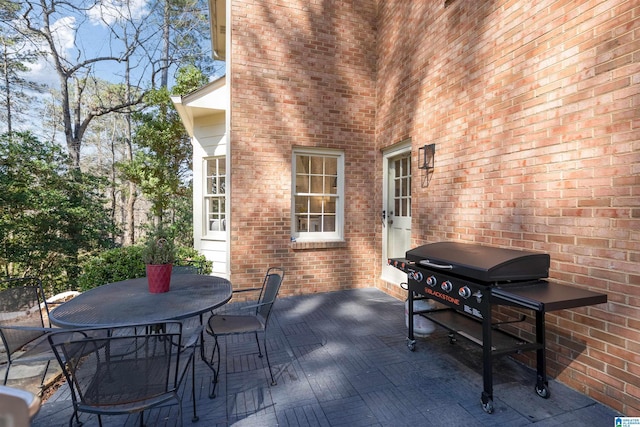 view of patio featuring grilling area and outdoor dining area