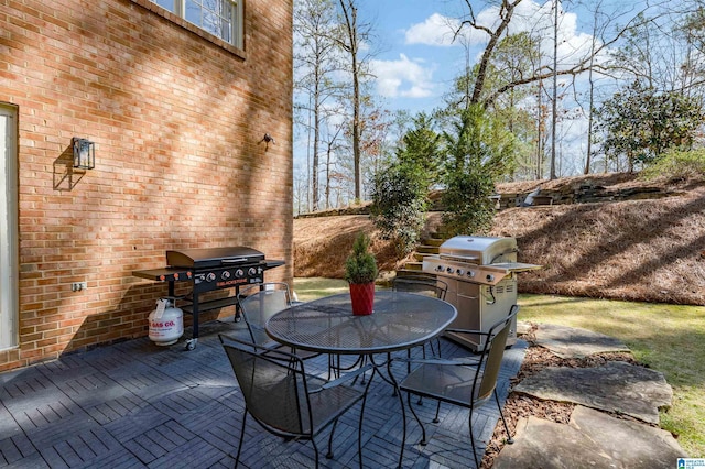 view of patio / terrace featuring outdoor dining area and grilling area