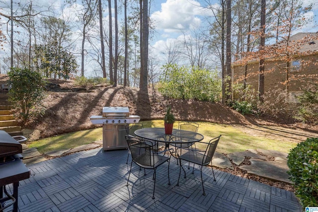 view of patio featuring outdoor dining area