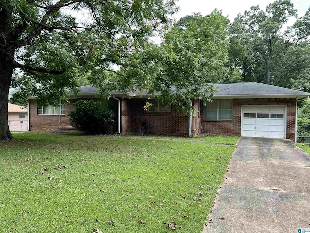 single story home featuring a garage, driveway, a front lawn, and brick siding