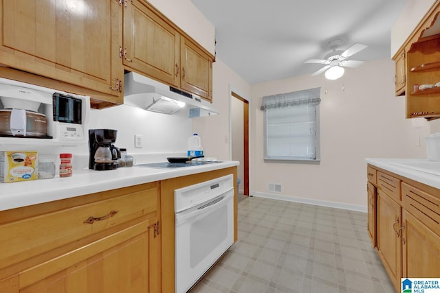 kitchen featuring under cabinet range hood, black electric stovetop, light countertops, and oven