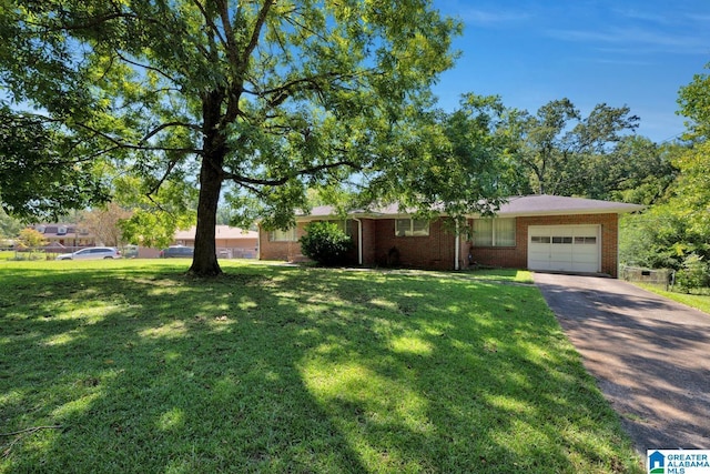 ranch-style home featuring brick siding, an attached garage, driveway, and a front lawn