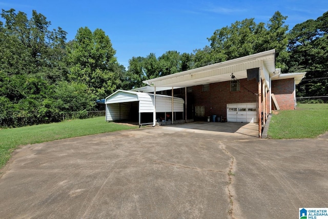 view of front of house with a carport, a front lawn, concrete driveway, and brick siding