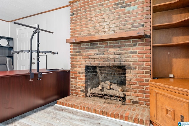 1877 Old Sylacauga Hwy, Sylacauga, AL 35150 - interior details with a brick fireplace, crown molding, and wood finished floors