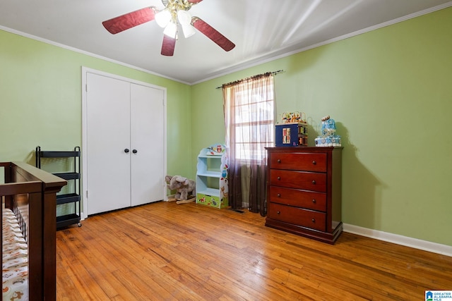 1877 Old Sylacauga Hwy, Sylacauga, AL 35150 - bedroom with light wood-type flooring, baseboards, ornamental molding, and a closet