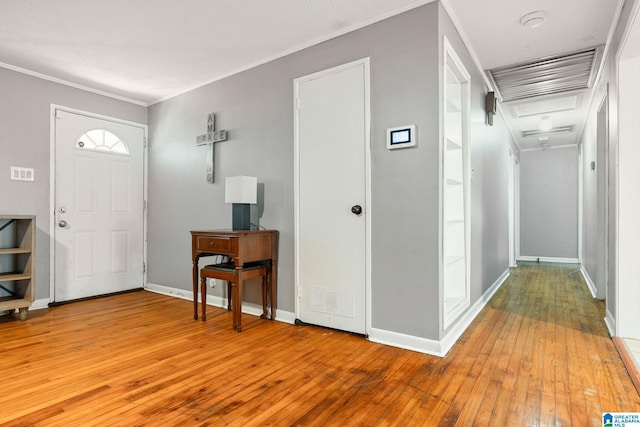 1877 Old Sylacauga Hwy, Sylacauga, AL 35150 - entrance foyer featuring light wood finished floors, baseboards, and crown molding