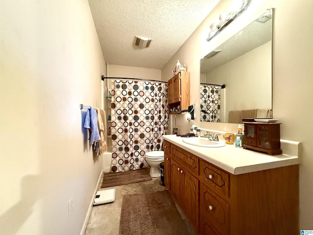 bathroom with visible vents, toilet, vanity, a textured ceiling, and baseboards