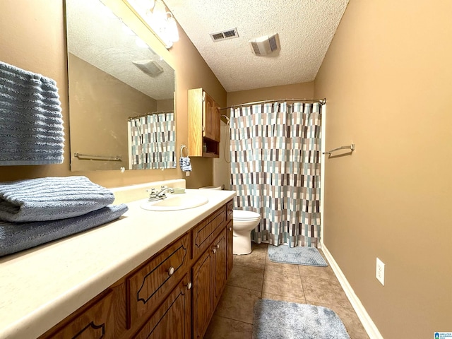 bathroom featuring visible vents, toilet, tile patterned flooring, a textured ceiling, and vanity