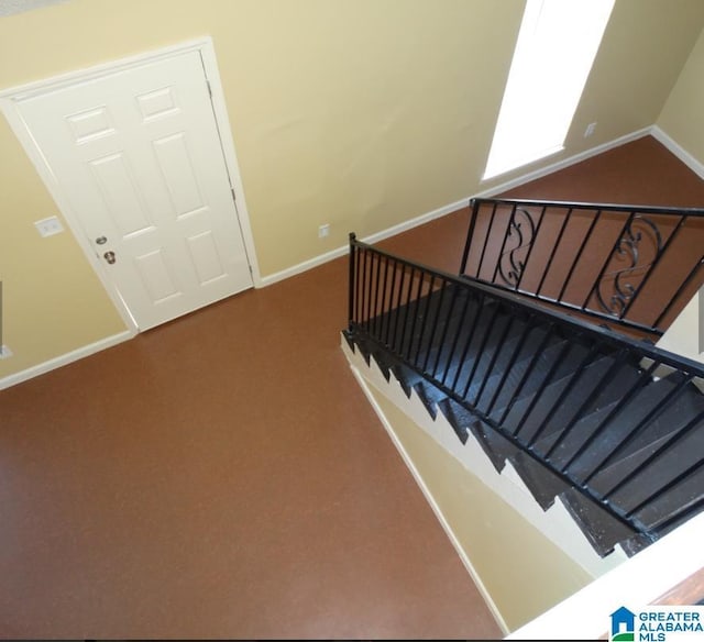 staircase with carpet floors and baseboards