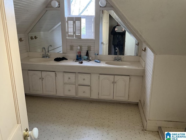 bathroom with double vanity and a sink