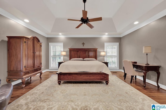 bedroom featuring ornamental molding, recessed lighting, wood finished floors, and baseboards