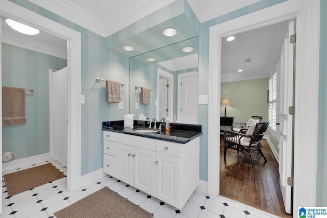 bathroom featuring crown molding, curtained shower, vanity, baseboards, and tile patterned floors