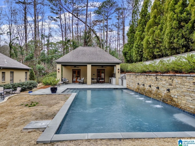 pool featuring ceiling fan, a patio, a storage structure, an outdoor structure, and fence