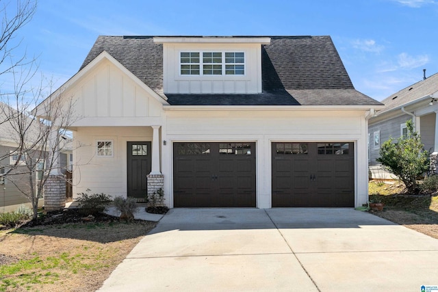 view of front of property with a garage, a shingled roof, board and batten siding, and concrete driveway