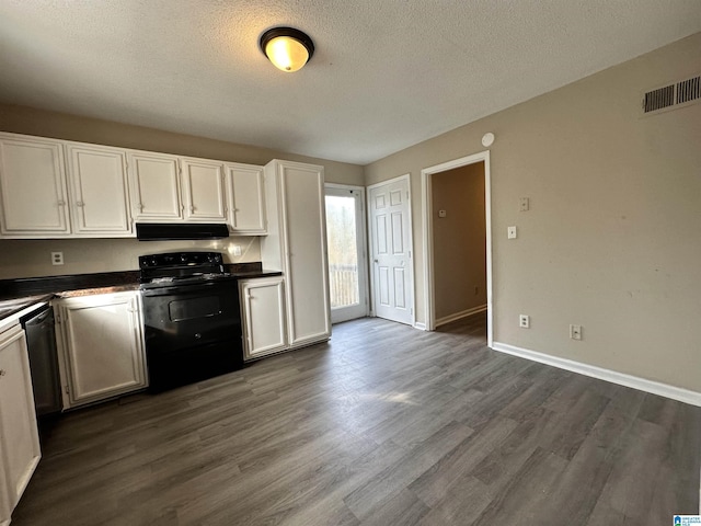 kitchen featuring dark countertops, white cabinets, and black electric range oven