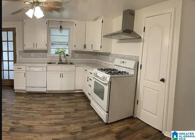 kitchen with white cabinets, wall chimney range hood, white appliances, and light countertops