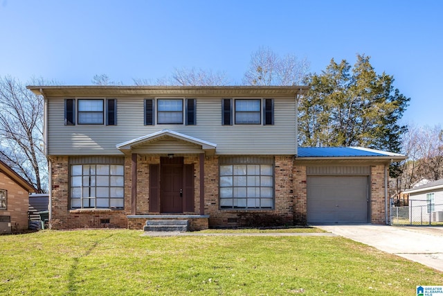 colonial inspired home with a garage, concrete driveway, crawl space, a front lawn, and brick siding