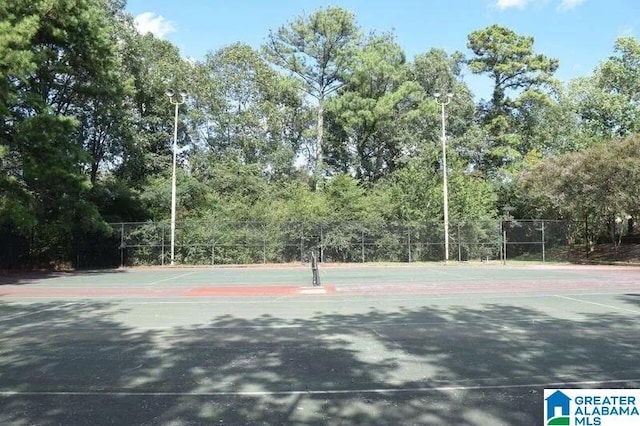 view of sport court with fence