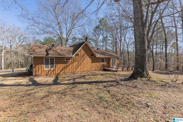 exterior space with a deck and board and batten siding