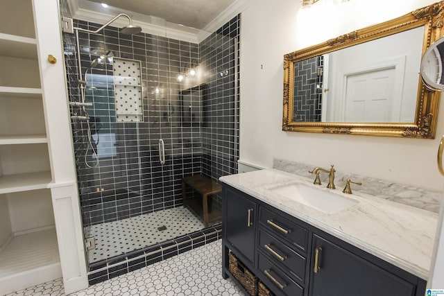 bathroom featuring ornamental molding, a stall shower, and vanity