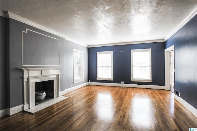 unfurnished living room featuring a fireplace with flush hearth, baseboards, wood finished floors, and ornamental molding