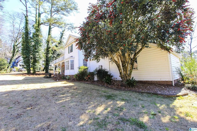 view of home's exterior featuring a yard