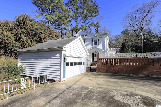 view of side of home featuring fence