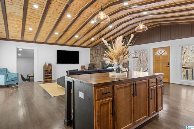 kitchen with open floor plan, a kitchen island, and wood ceiling