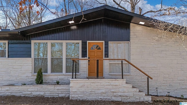 view of front of home featuring stone siding