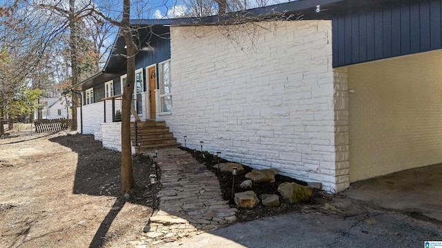 view of property exterior with fence