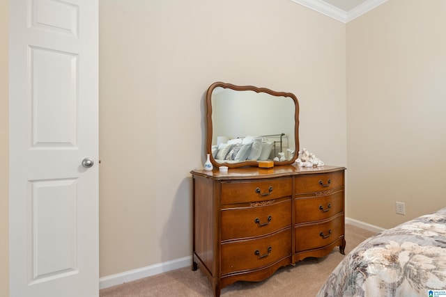 bedroom featuring baseboards, crown molding, and light colored carpet