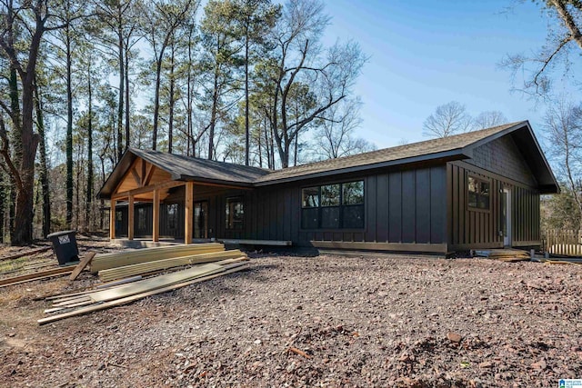 rear view of house with board and batten siding