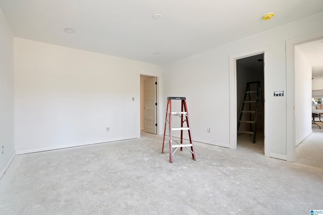 empty room featuring concrete flooring