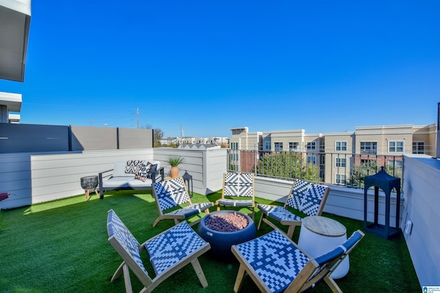 balcony featuring an outdoor fire pit