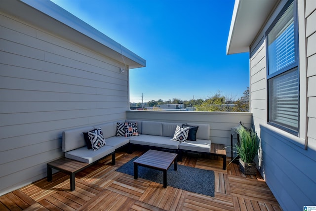 wooden deck featuring an outdoor living space