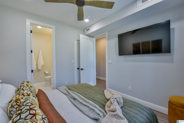 bedroom featuring visible vents, baseboards, a ceiling fan, and ensuite bathroom